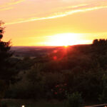 Sonnenuntergang von der Aussichtsterrasse und Biergarten des Hotels "Die Post"